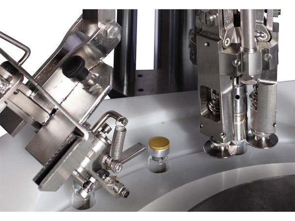 Revolution Capper Cappers & Retorquers: In-Line Cappers & Rotary Screw Capping Machines | NJM